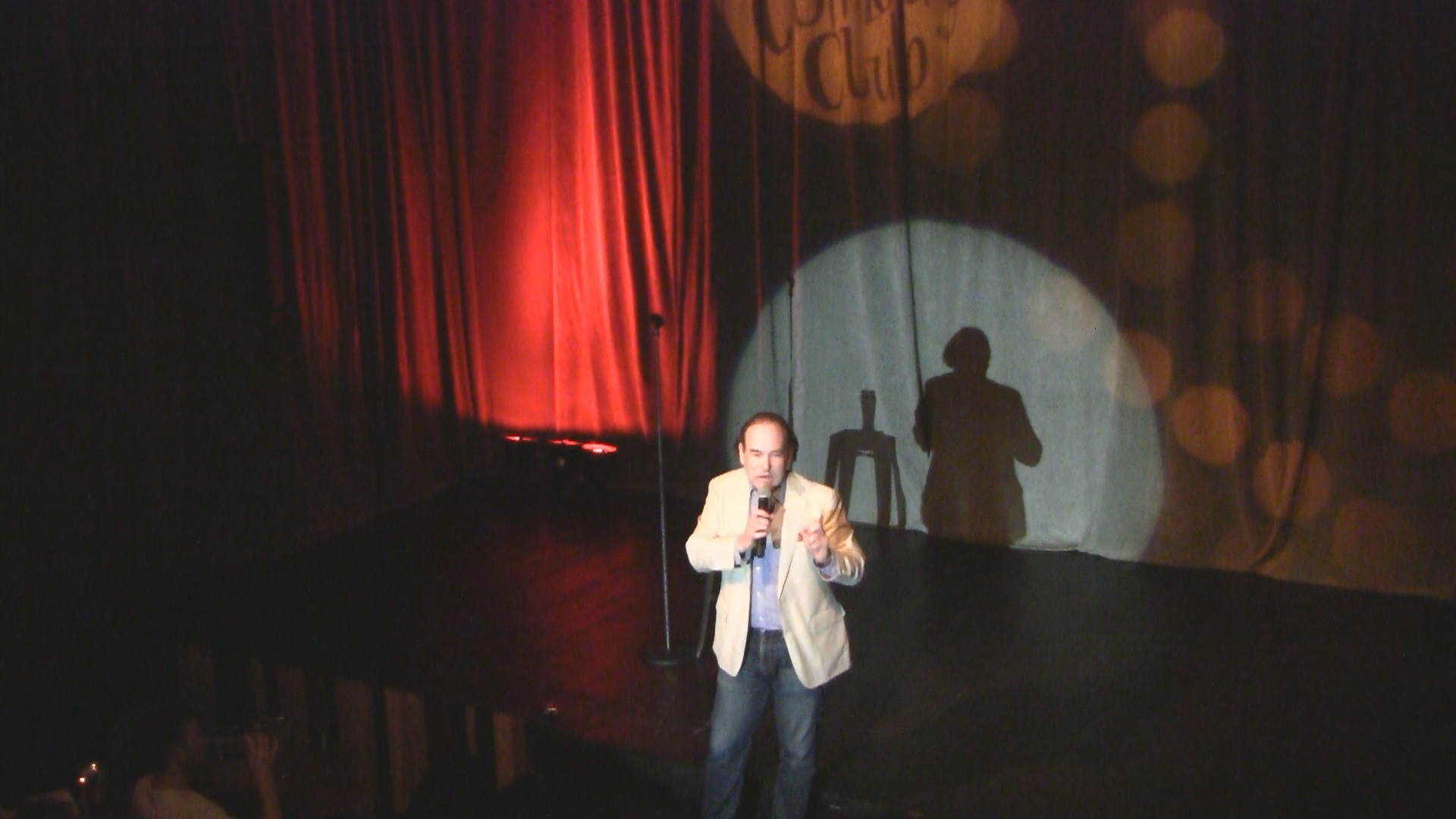 Internationally headlining comedian Shaun Eli on stage at Cape Town Comedy Club in South Africa