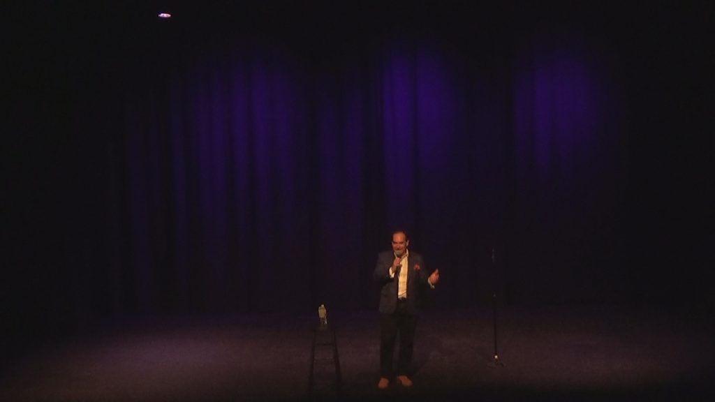 Clean Corporate Stand-up Comedian Shaun Eli on stage at NY's Emelin Theatre