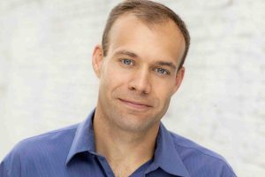 Comedian Keith Alberstadt in a blue shirt