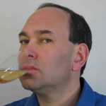 Hire corporate comedian Shaun Eli for your next event (photo of the comedian drinking Champagne)